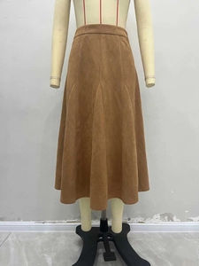 Elegant high-waisted brown faux suede A-line midi skirt with a flowy silhouette