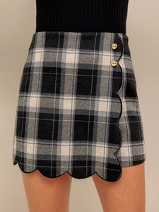 Retro black and white plaid shorts with scalloped edge and decorative gold buttons