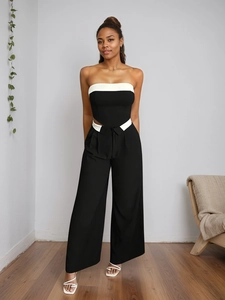 Elegant black and white high-waist wide-leg trousers and bandeau top set for women