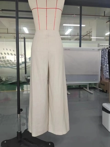 Women's high waist wide leg beige trousers with vertical texture and relaxed drape fit