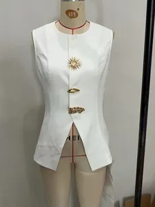 Detailed view of white vest featuring unique gold sun and lip-shaped decorative buttons