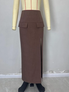 Deep brown high-waisted maxi skirt with side slit and decorative pocket flaps
