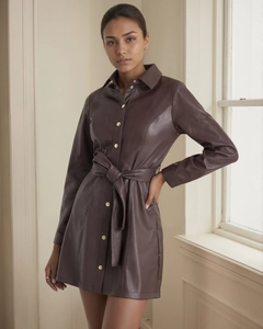Detailed texture of dark brown PU leather trench coat with waist belt and metal buttons