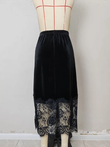 Detail of high waist velvet skirt with delicate lace patchwork and elastic waistband