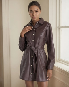 Detail of deep brown PU leather shirt dress with waist belt and button cuffs