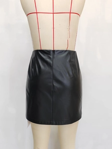 Slim fit high waist black PU leather A-line mini skirt with back zipper on mannequin