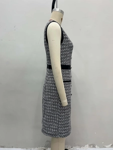 Side view of French vintage houndstooth tweed sleeveless dress with leather trim
