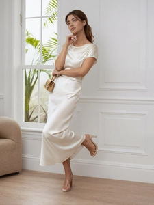 Elegant ivory satin off-shoulder long dress with a slim fit and glossy silk-like finish