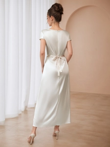 Elegant champagne satin maxi dress for women featuring a stylish back tie waist design