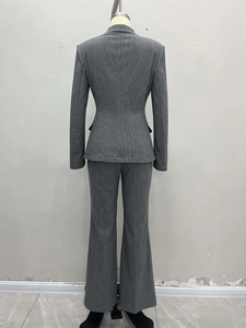 Women's professional two-piece grey houndstooth suit with blazer and flared trousers