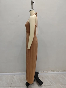 Detail of a brown sleeveless wide-leg jumpsuit with a waist belt and halter neck design