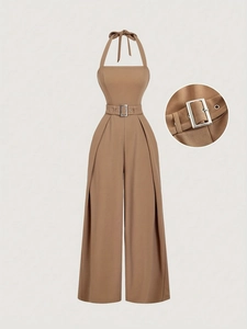 Detail of high-waist brown jumpsuit with a metal buckle belt and pleated wide-leg pants