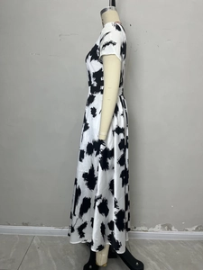 Detail view of high waist short sleeve dress with black and white abstract ink print