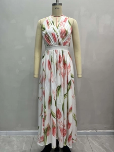 Floral A-line maxi dress with pink tulips, V-neck, open back, and flowing waist design