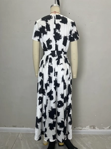 Modern black and white abstract print maxi dress with high waist and short sleeves