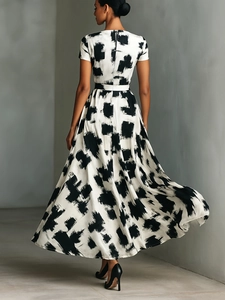 Modern abstract black and white print dress with high waist and short sleeves