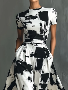 Modern abstract black and white print dress with high waist and functional side pockets