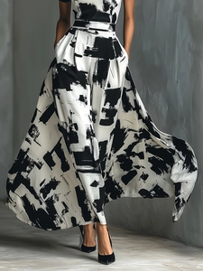Artistic black and white abstract print long dress with flowing A-line skirt detail