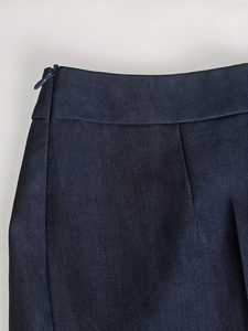 Detailed macro view of the side invisible zipper and twill fabric texture of professional suit pants