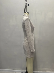 Detail of French style V-neck mini dress showing grey textured tweed knit fabric and slim fit
