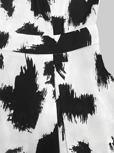 Close-up of high-waist dress detailing black and white abstract print with soft fabric texture