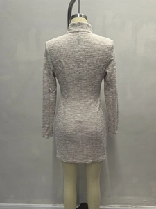 Detailed back view of a grey tweed long-sleeve dress with textured fabric and hidden zipper