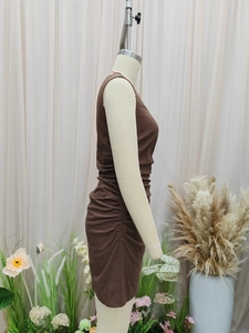 Detailed side view of brown sleeveless dress featuring ruched drawstring side design