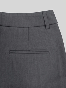 Detailed view of dark grey suit trousers featuring twill texture and rear welt pocket