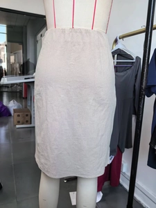 Women's chic beige faux suede midi skirt with high waist and side bow tie detail