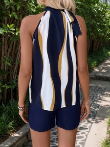 Elegant two-piece set featuring navy wavy stripe halter top and solid shorts for summer wear