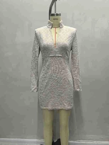 Elegant grey textured knit V-neck mini dress with long sleeves on a mannequin