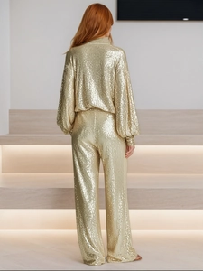 Women's glamorous gold sequin two-piece set featuring lantern sleeve top and wide-leg pants