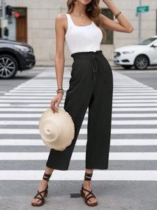 Detailed texture of black high-waisted linen wide-leg pants with adjustable drawstring