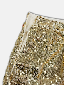 Detail of gold sequins on beige fabric featuring a high-quality invisible side zipper