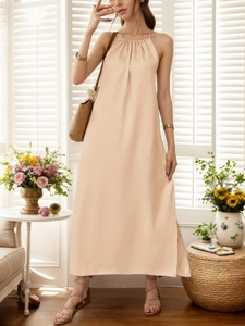 Elegant halter neck sleeveless beige maxi dress with side slit in linen texture