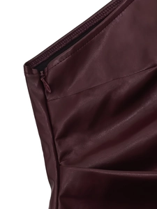 Detail of burgundy PU leather top showing smooth invisible zipper and refined stitching