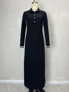 Women's black long-sleeve knit maxi dress with white trim piping and buttoned collar