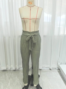 Olive green high waist casual pants with elastic ruffle waist and matching tie belt