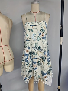 Elegant bohemian floral camisole dress with adjustable straps and white tassel hem