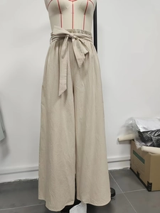 High-waist wide-leg trousers in beige with an adjustable bow-knot belt and fluid drape