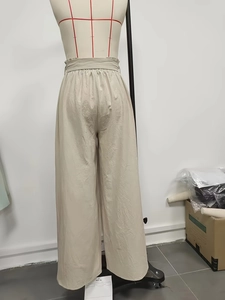 High waist wide leg cotton trousers with adjustable tie belt in light beige color