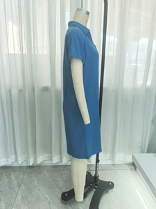 Side view of blue polo collar short dress showing the textured breathable fabric detail