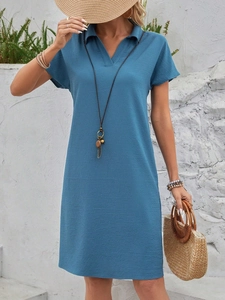Elegant blue short sleeve V-neck dress for women in casual resort style with textured fabric