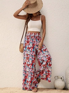Detail of high waisted floral wide leg trousers with bohemian elastic pleated waistband