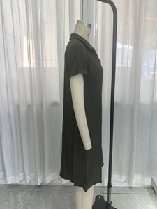 Side view of olive green short sleeve dress featuring a polo collar and textured fabric