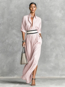 Detail showing the light pink long sleeve dress with waist belt and shirt collar design