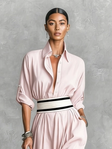 Detail of light pink shirt dress with white buttons and black white striped waist belt