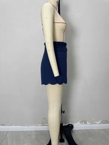 High-waisted navy shorts for women featuring paperbag waist and scalloped wave hemline