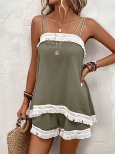 Detail of olive green two-piece set with white fringe lace trim and double straps
