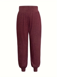 Detail of high waist joggers in wine red marl fabric with elasticated ankle cuffs